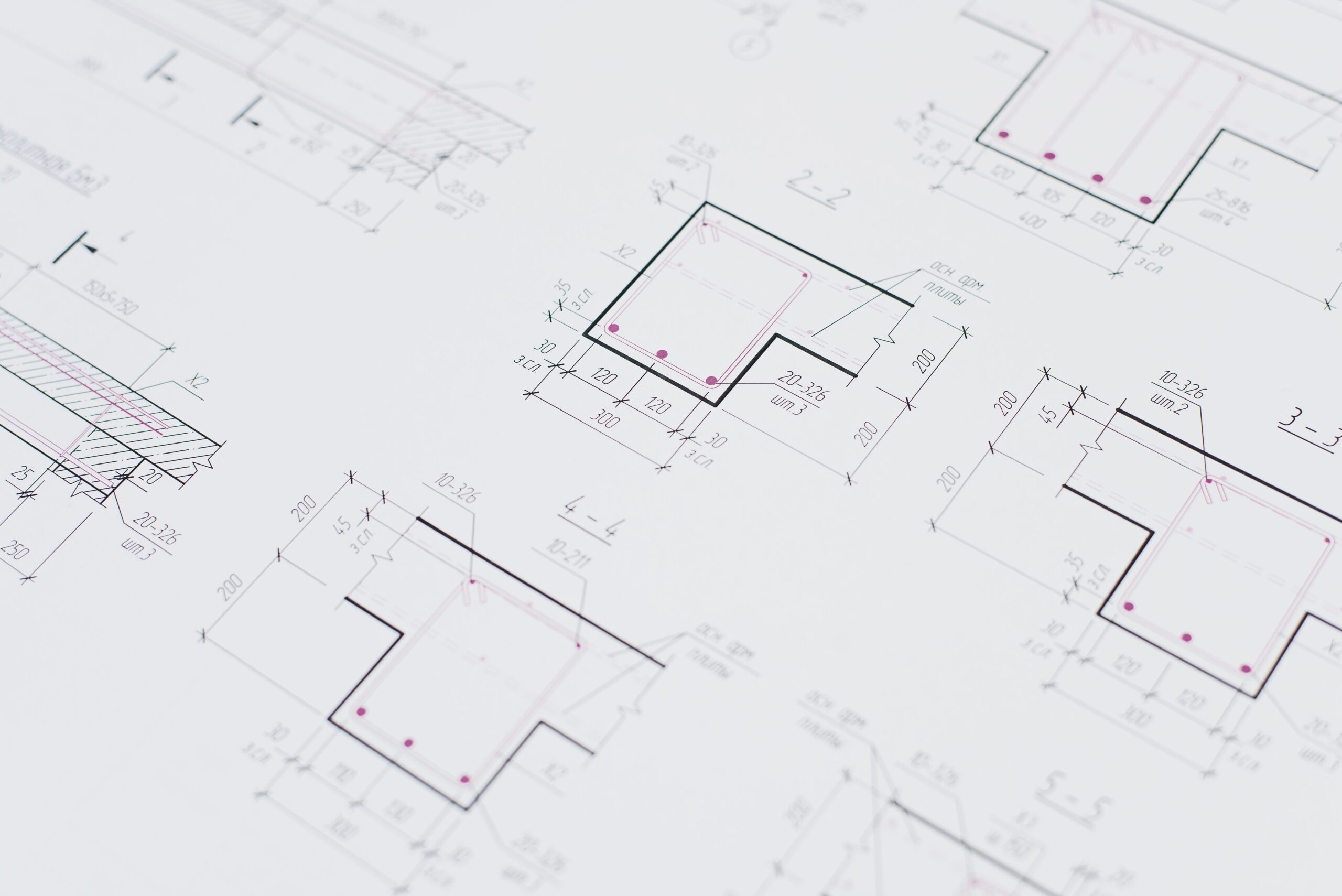 why-choose-us High-resolution close-up of detailed architectural blueprints showcasing precision design layouts.